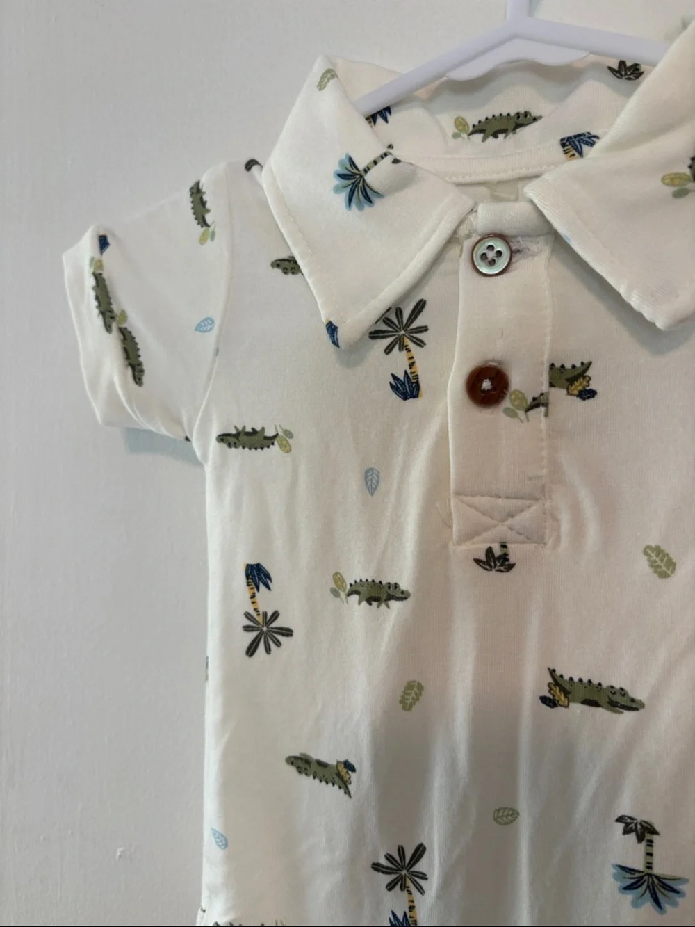 Cream Baby Polo Onesie with tropical print